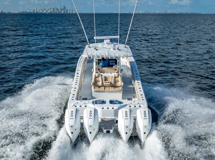  Yacht Photos Pics Freeman 35 boat cruising on ocean, city skyline in background, 2025 model.