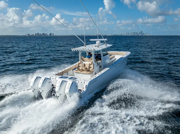  Yacht Photos Pics 2025 Freeman 35 boat cruising on open water with city skyline in background.