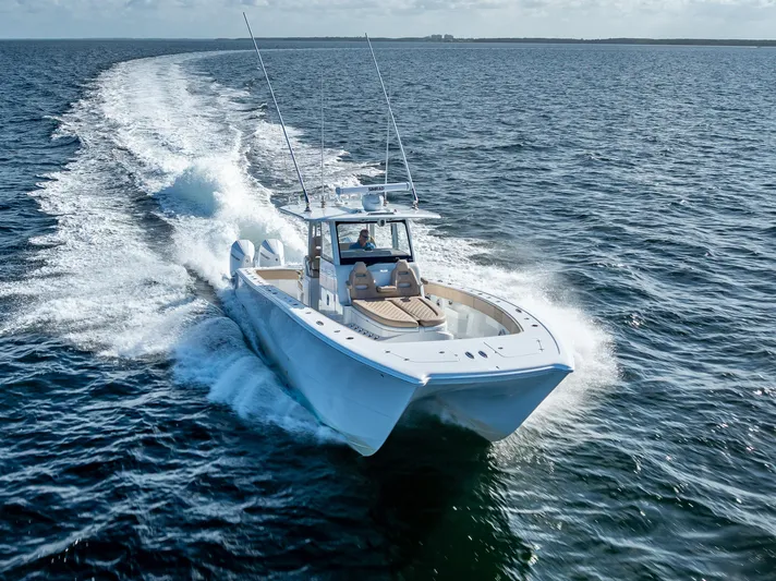  Yacht Photos Pics 2025 Freeman 35 boat cruising swiftly on open ocean waters.