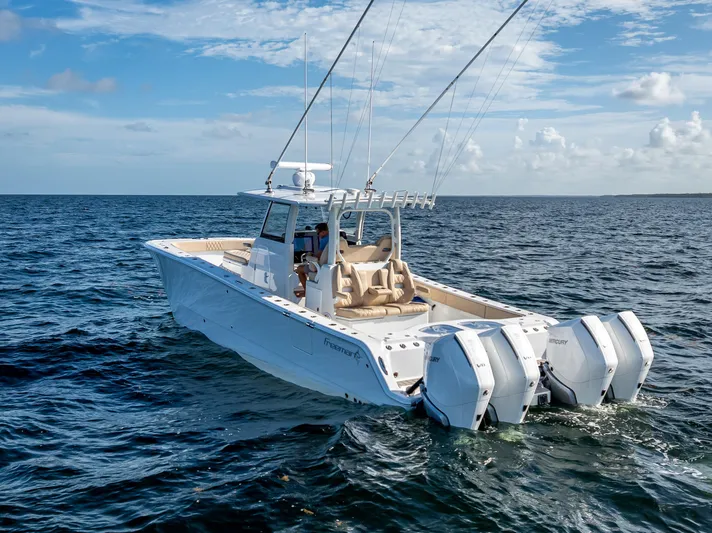  Yacht Photos Pics 2025 Freeman 35 boat cruising on open ocean under clear blue sky.