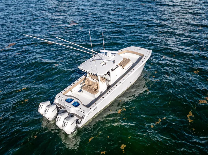  Yacht Photos Pics 2025 Freeman 35 boat on open water, featuring dual outboard engines.