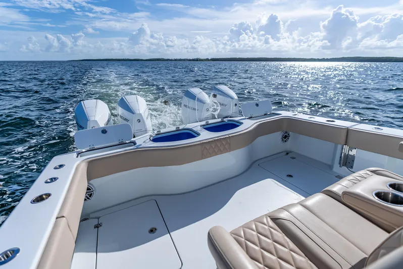  Yacht Photos Pics Freeman 35 boat cruising on open water, showcasing luxurious seating and powerful engines.