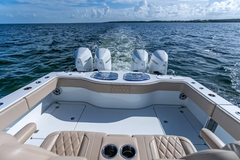  Yacht Photos Pics Freeman 35 boat, 2025 model, with four Mercury engines cruising on open water.