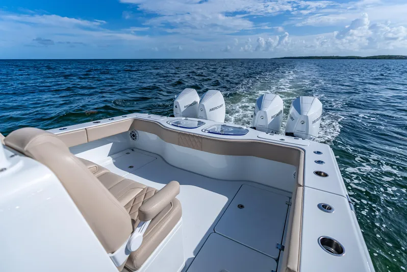  Yacht Photos Pics 2025 Freeman 35 boat with triple Mercury engines cruising on open water.