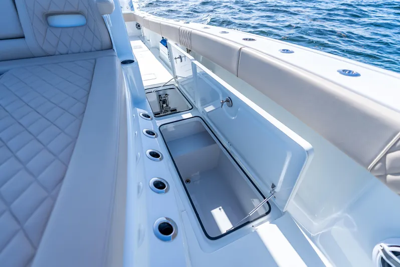  Yacht Photos Pics Luxurious Freeman 35 boat interior with open storage compartment, 2025 model, on the water.