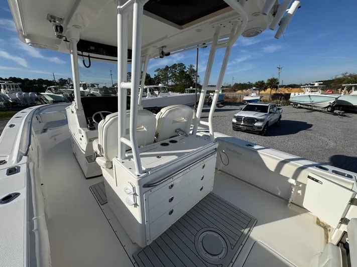  Yacht Photos Pics 2017 Edgewater 320CC boat interior with seating and storage, parked outdoors.
