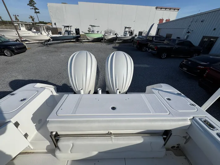  Yacht Photos Pics 2017 Edgewater 320CC boat with dual outboard motors in a marina setting.