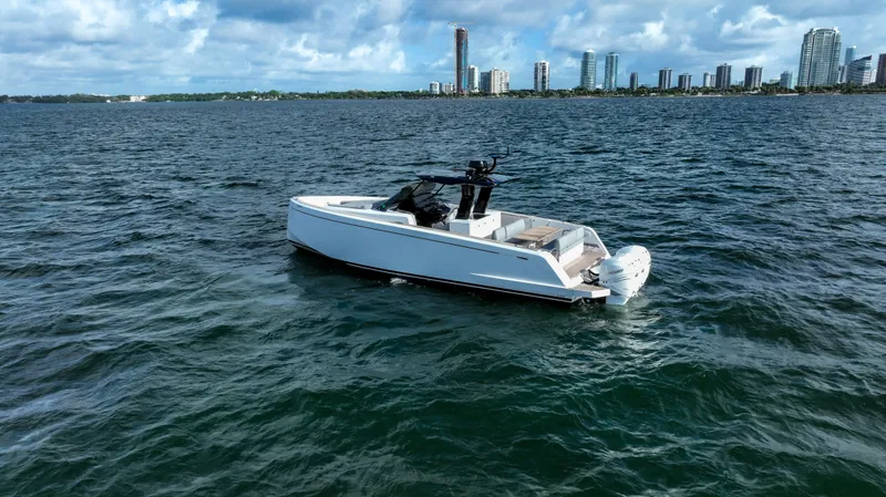  Yacht Photos Pics 2020 Pardo Yachts P38 on open water with city skyline in background.