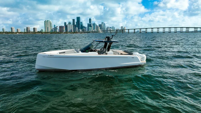 Yacht Photos Pics Pardo Yachts P38 (2020) cruising near a city skyline and bridge on a sunny day.