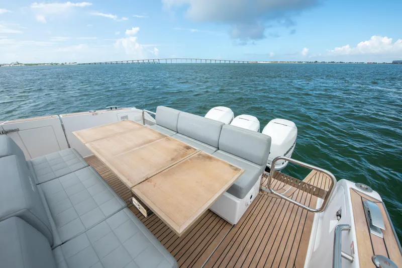  Yacht Photos Pics 2020 Pardo Yachts P38 deck with seating and table, overlooking ocean and bridge.