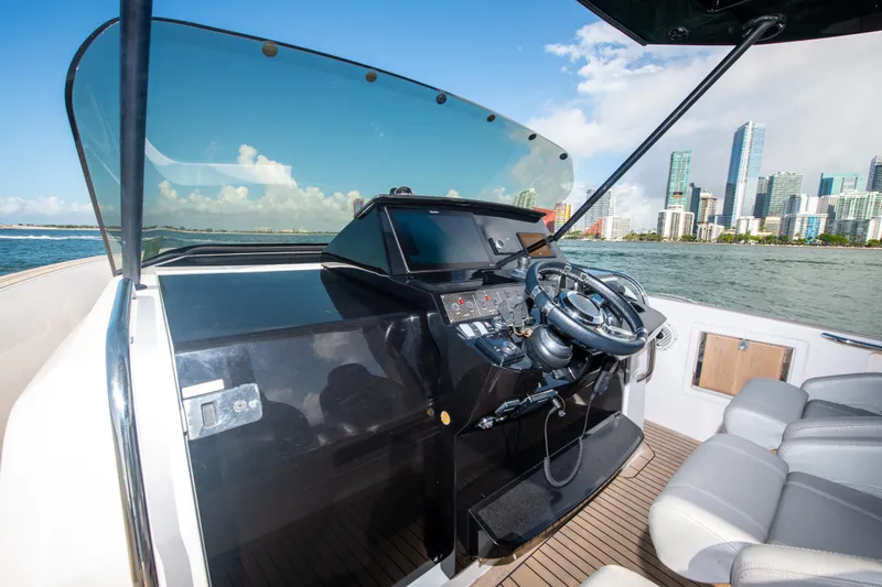  Yacht Photos Pics Cockpit of 2020 Pardo Yachts P38 with city skyline in background.