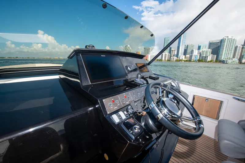  Yacht Photos Pics Helm of 2020 Pardo Yachts P38 with city skyline in background.
