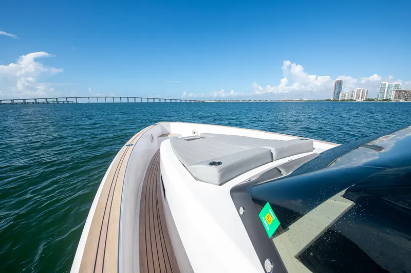  Yacht Photos Pics 2020 Pardo Yachts P38 cruising on open water with cityscape and bridge in background.