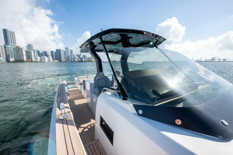  Yacht Photos Pics 2020 Pardo Yachts P38 cruising near city skyline on sunny day.