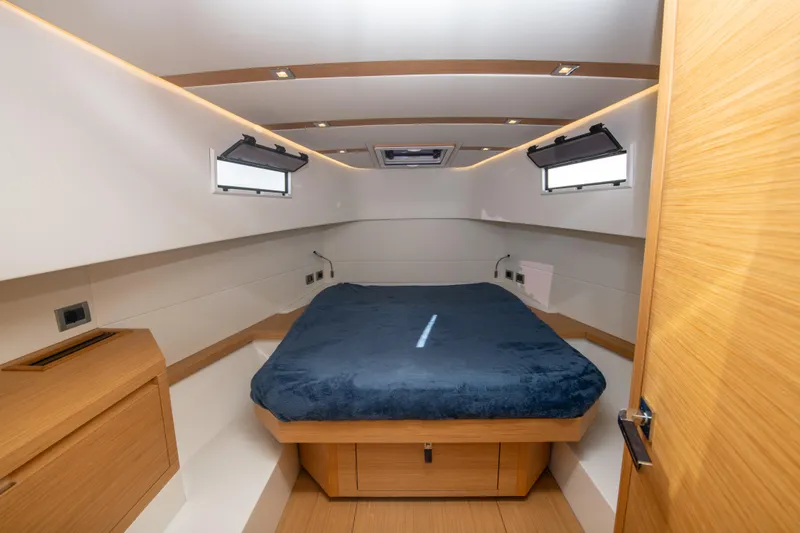  Yacht Photos Pics Luxurious cabin interior of 2020 Pardo Yachts P38 with modern design and cozy bedding.