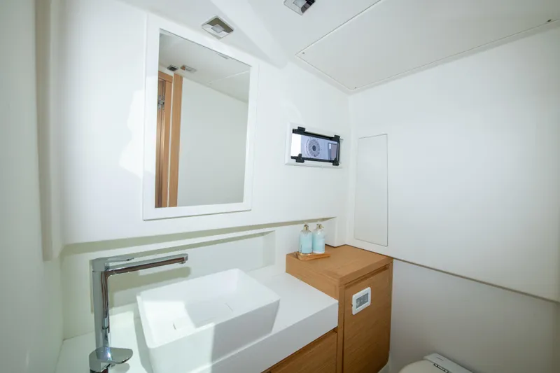  Yacht Photos Pics Modern bathroom interior on 2020 Pardo Yachts P38, featuring sleek sink and wooden cabinetry.