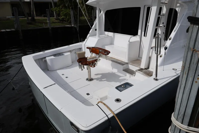  Yacht Photos Pics 2005 Viking 52 Convertible yacht, spacious deck with seating and fishing equipment.