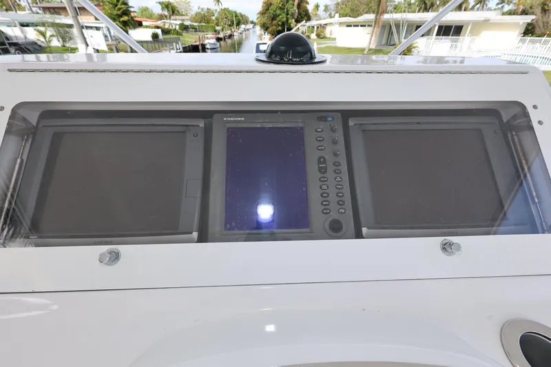  Yacht Photos Pics Control panel of a 2005 Viking 52 Convertible boat with navigation screens.