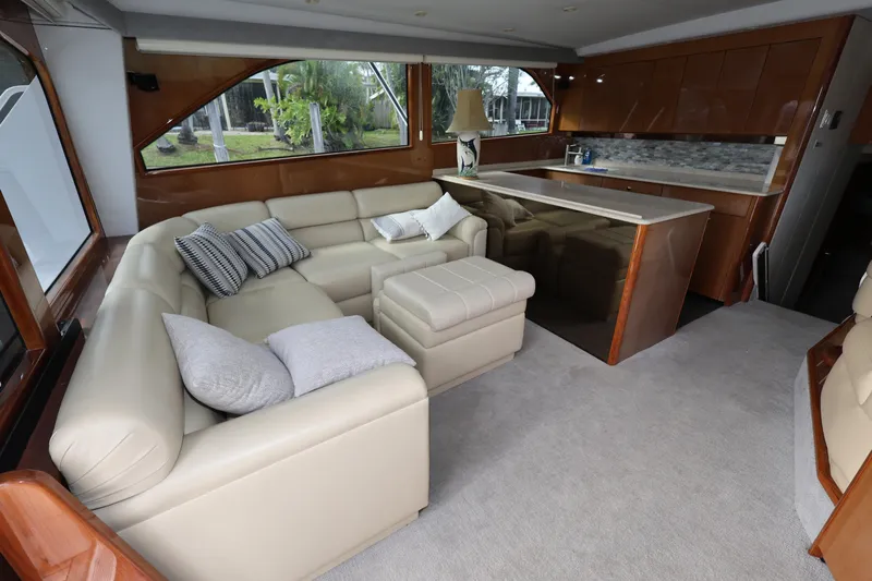  Yacht Photos Pics Luxurious interior of 2005 Viking 52 Convertible yacht with beige leather seating.