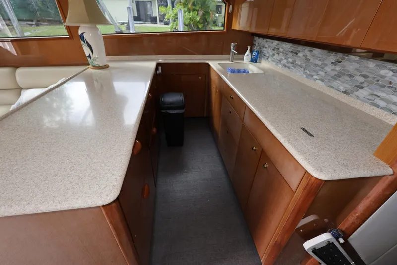  Yacht Photos Pics Interior of 2005 Viking 52 Convertible yacht kitchen with countertops and cabinets.