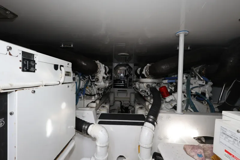  Yacht Photos Pics Engine room of a 2005 Viking 52 Convertible yacht, showcasing machinery and components.