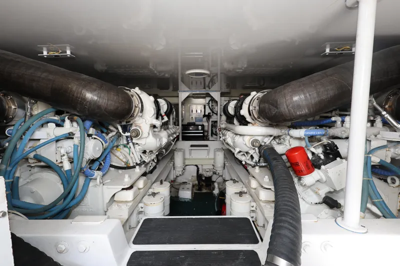  Yacht Photos Pics Engine room of 2005 Viking 52 Convertible yacht, showcasing dual engines and mechanical components.