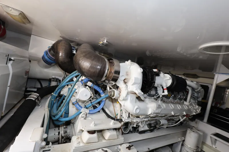  Yacht Photos Pics Engine room of 2005 Viking 52 Convertible yacht, showcasing complex machinery and components.