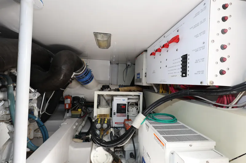  Yacht Photos Pics Engine room of 2005 Viking 52 Convertible with control panels and wiring.