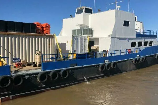 Southern Comfort Yacht Photos Pics AlumaCat 100 vessel from 2000 docked, featuring blue and white design with safety equipment.