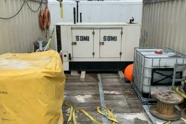 Southern Comfort Yacht Photos Pics Outdoor industrial setup with AlumaCat 100 generator, containers, and equipment.