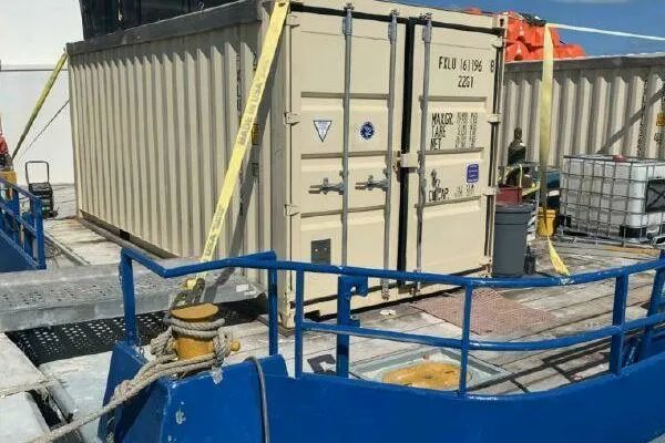 Southern Comfort Yacht Photos Pics AlumaCat 100 container from 2000 on a ship deck with safety straps.