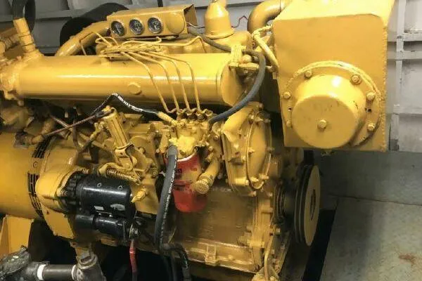 Southern Comfort Yacht Photos Pics Yellow AlumaCat 100 engine from 2000, showcasing intricate mechanical components.