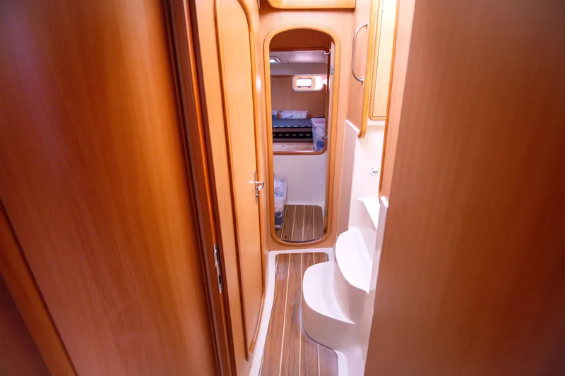  Yacht Photos Pics Interior of 2006 Leopard 40 yacht with wooden finishes and compact design.
