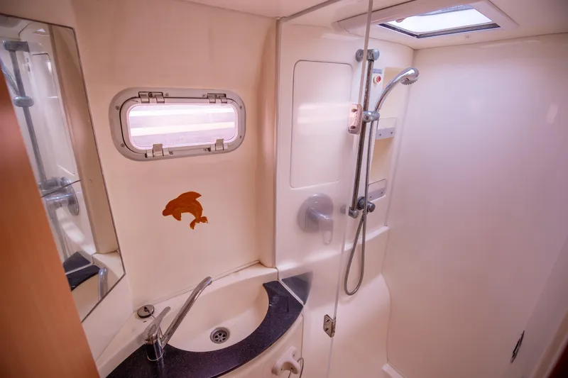  Yacht Photos Pics Bathroom interior of a 2006 Leopard 40 yacht with shower and sink.