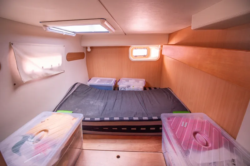  Yacht Photos Pics 2006 Leopard 40 yacht cabin with bed and storage containers.