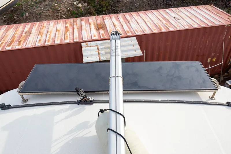  Yacht Photos Pics Rooftop solar panel on 2006 Leopard 40 catamaran, with shipping containers in background.