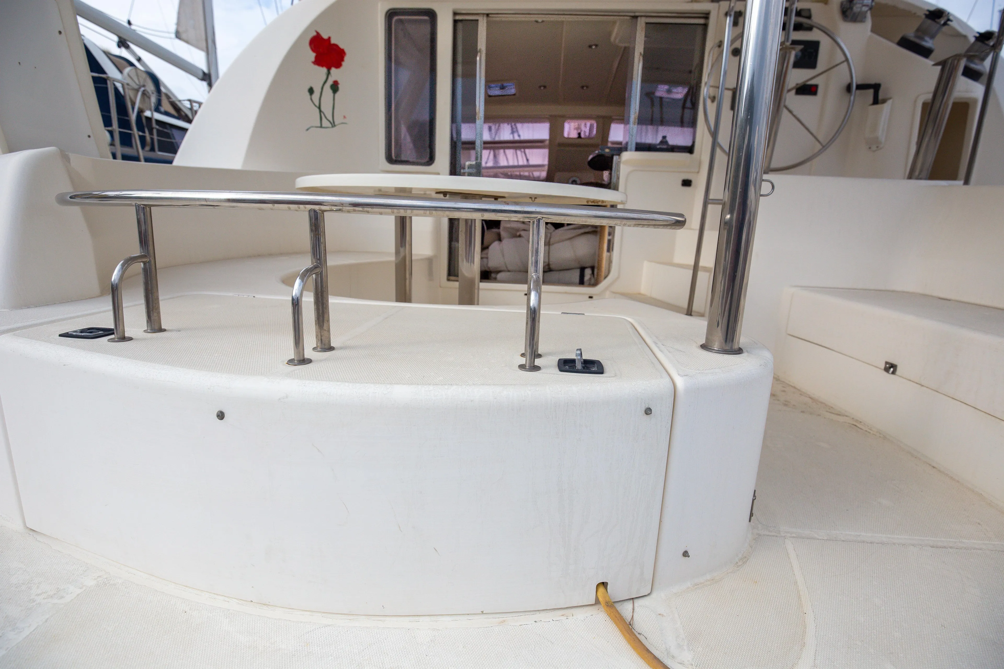 2006 Leopard 40 yacht cockpit with seating, table, and helm station.