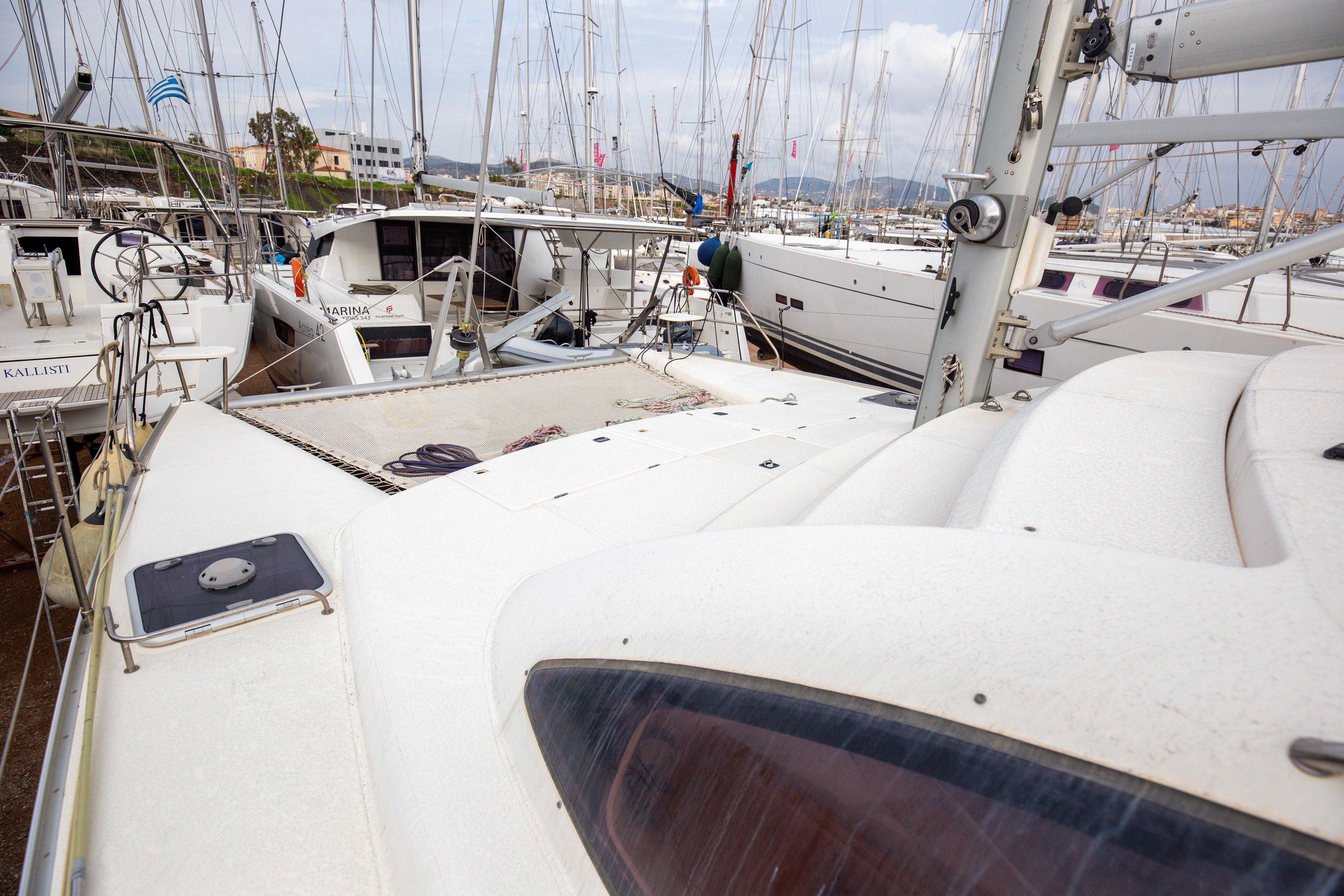 2006 Leopard 40 catamaran docked in a marina with other sailboats.