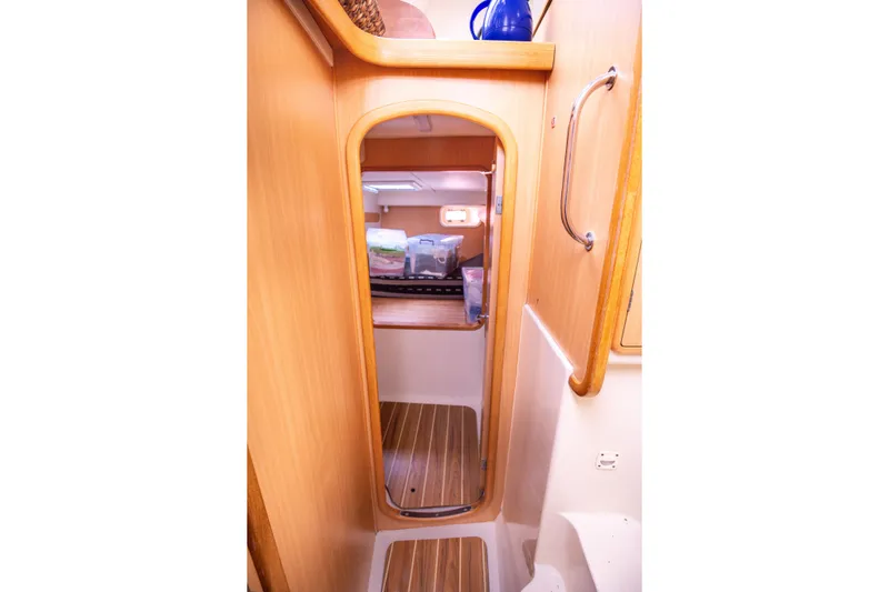  Yacht Photos Pics Interior of 2006 Leopard 40 yacht, featuring wooden door and flooring.
