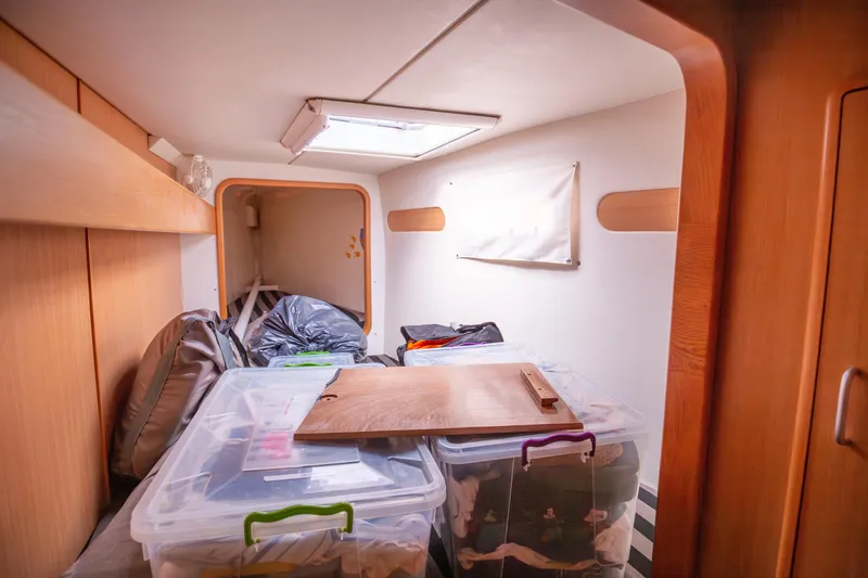 Yacht Photos Pics Interior of a 2006 Leopard 40 yacht cabin with storage boxes and bags.
