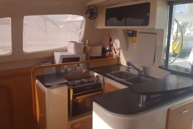  Yacht Photos Pics Interior view of a 2006 Leopard 40 catamaran kitchen with modern amenities.