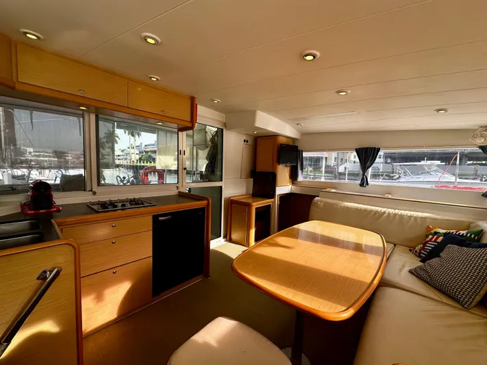 Selkie Yacht Photos Pics Interior of 2012 Lagoon 400 catamaran with kitchen and seating area.
