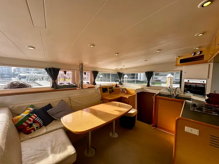 Selkie Yacht Photos Pics Interior of 2012 Lagoon 400 catamaran with modern kitchen and cozy seating area.