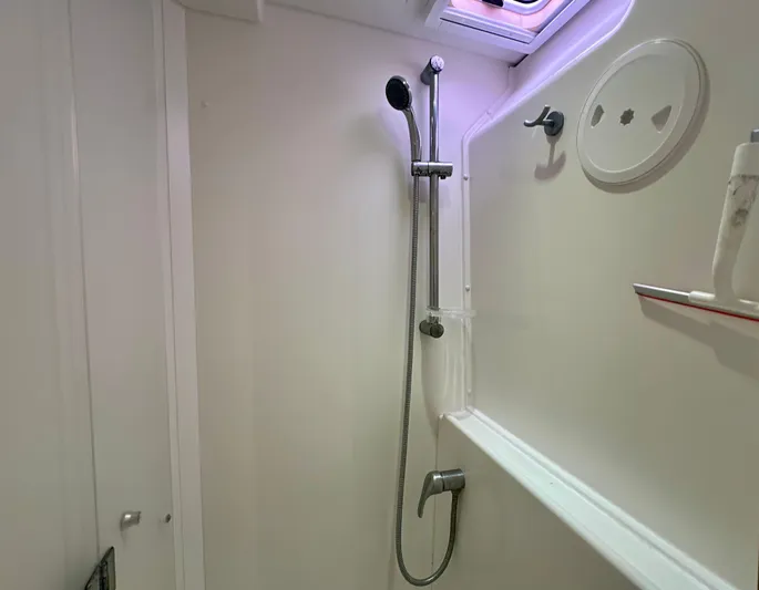Selkie Yacht Photos Pics Shower area in a 2012 Lagoon 400 yacht, featuring a sleek, modern design.