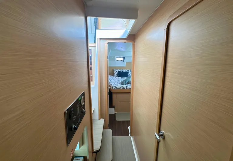 Selkie Yacht Photos Pics Interior of 2012 Lagoon 400 yacht, featuring a cozy cabin with wooden finishes.