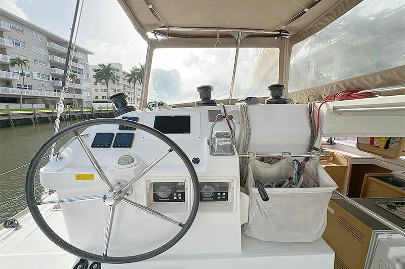 Selkie Yacht Photos Pics Helm of 2012 Lagoon 400 catamaran with steering wheel and navigation instruments.