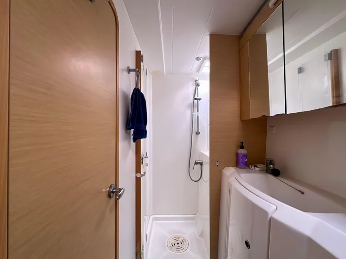 Selkie Yacht Photos Pics Bathroom interior of a 2012 Lagoon 400 yacht with shower and sink.