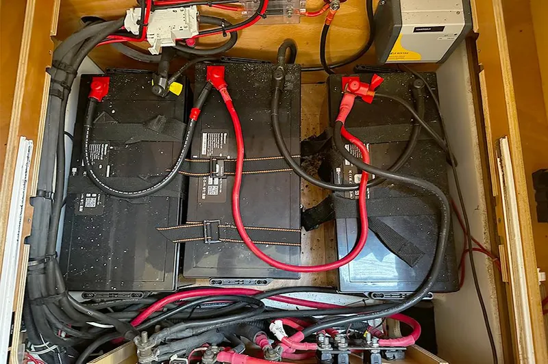 Selkie Yacht Photos Pics Battery compartment of a 2012 Lagoon 400 catamaran with wiring and connections.