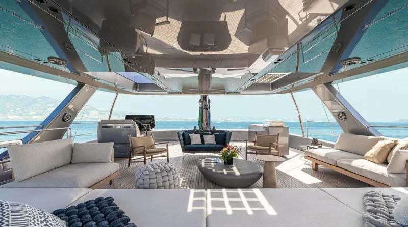 Apollo 99 Yacht Photos Pics Luxurious interior of 2023 Sunreef 80 Eco yacht with elegant seating and ocean view.