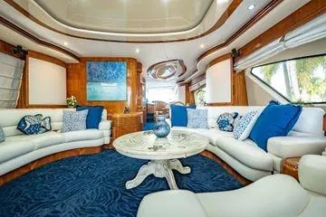The Cure Yacht Photos Pics Luxurious interior of 2003 Azimut 80 Carat yacht with elegant blue and white decor.